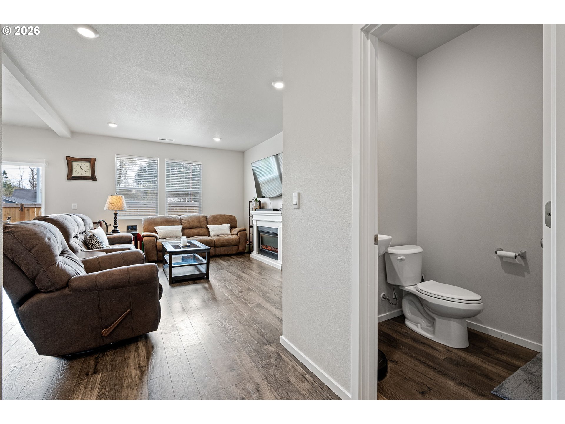 2259 30th Place Springfield, OR 97477 - Photo 10 of 48 a living room with furniture a toilet a sink and a window