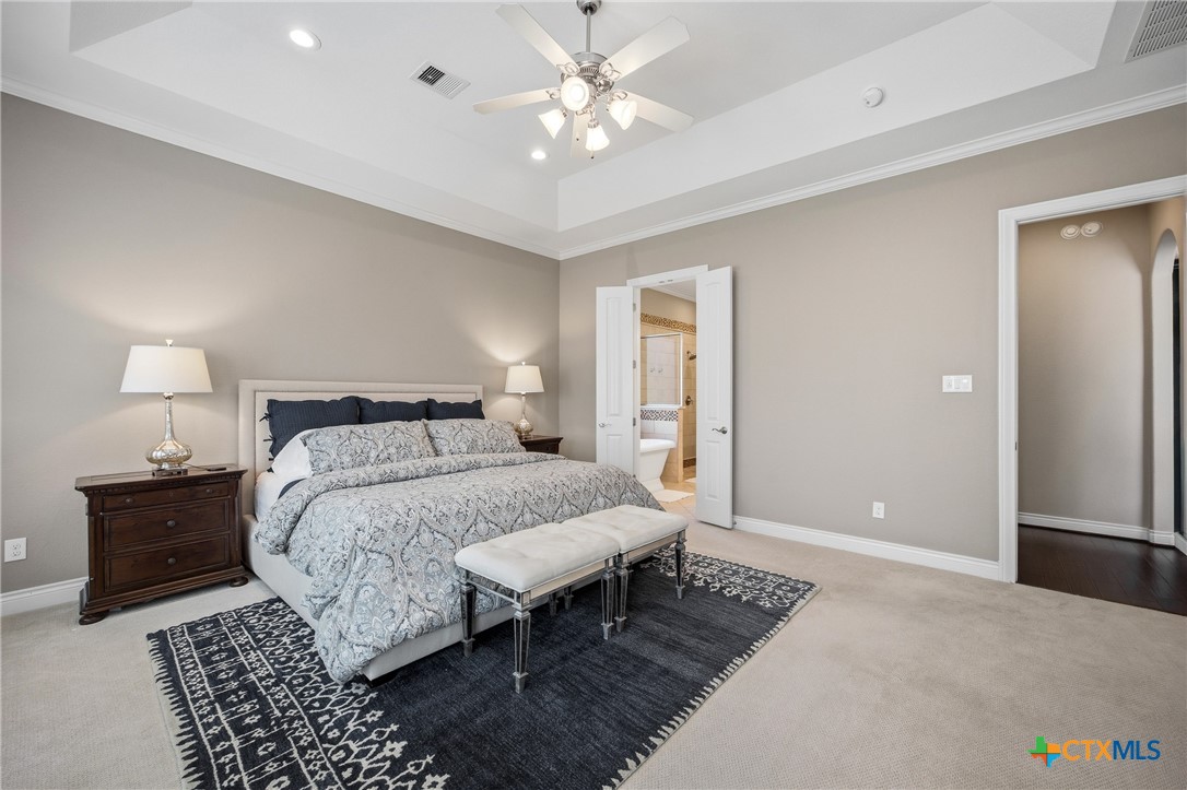 2427 Anderson Point Lane Spring, TX 77388 - Photo 24 of 47 a bedroom with a bed and a chandelier