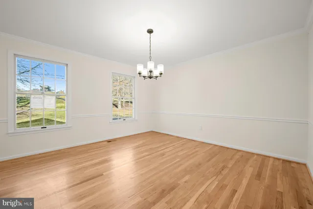 a kitchen with white cabinets stainless steel appliances and sink