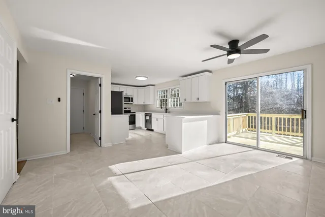 a view of room with hardwood floor and window