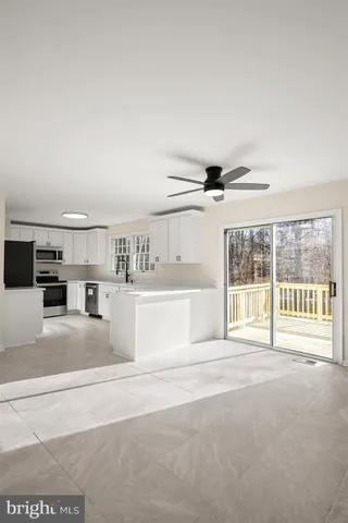 a bathroom with a bathtub sink and a mirror