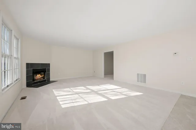 a view of livingroom with a ceiling fan and window