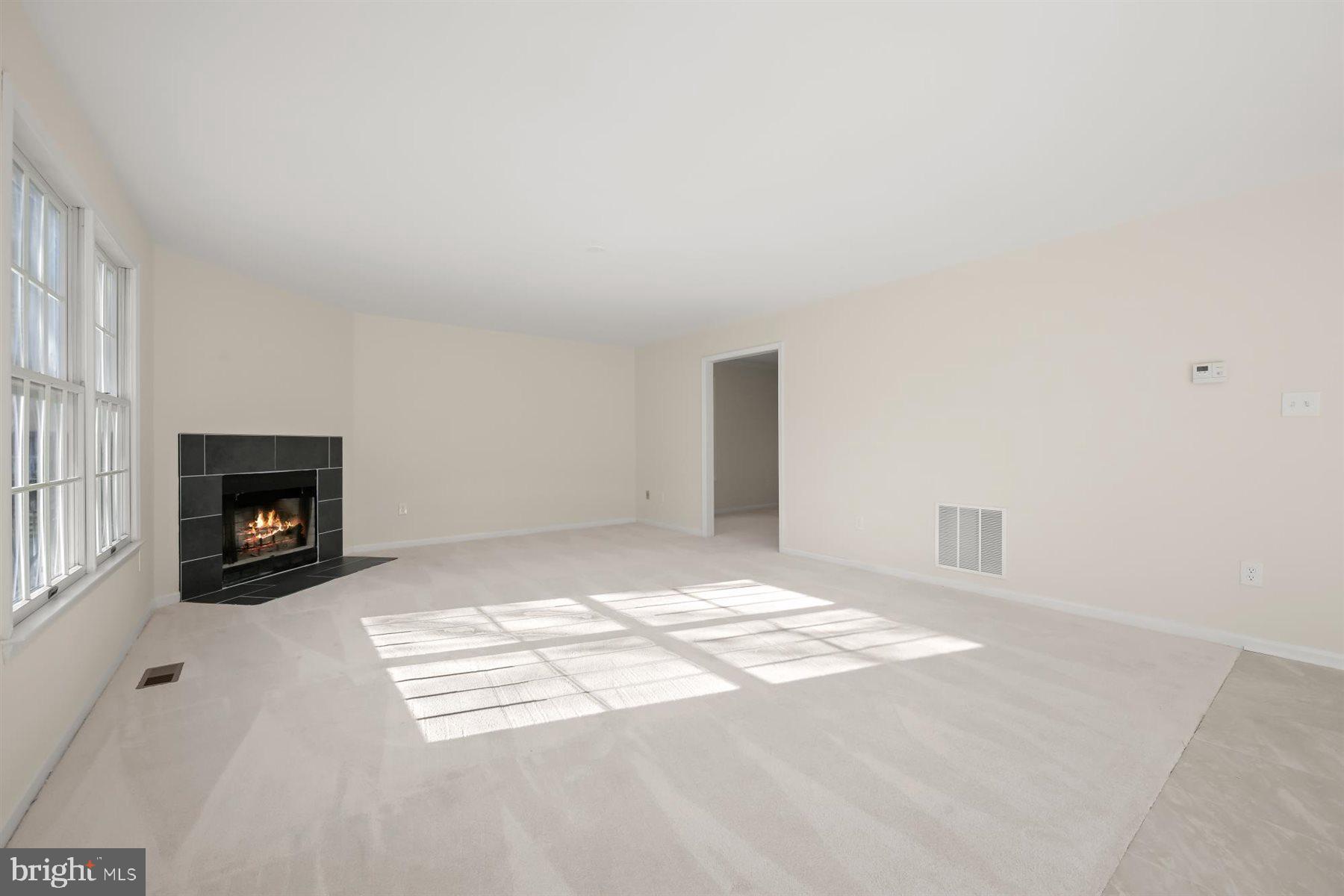 13121 Old Fletchertown Road Bowie, MD 20720 - Photo 31 of 91 a view of empty room with a fireplace