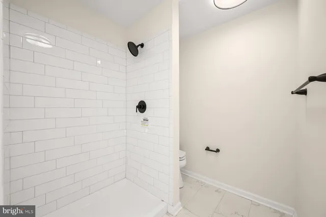 a picture of a wall with a white sign