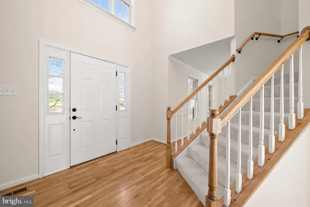 a view of entryway with wooden floor