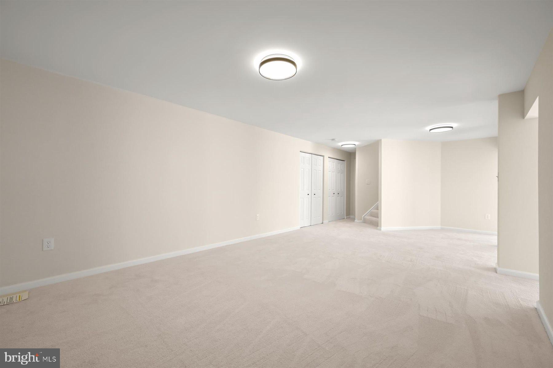 13121 Old Fletchertown Road Bowie, MD 20720 - Photo 60 of 91 a view of an empty room with a kitchen