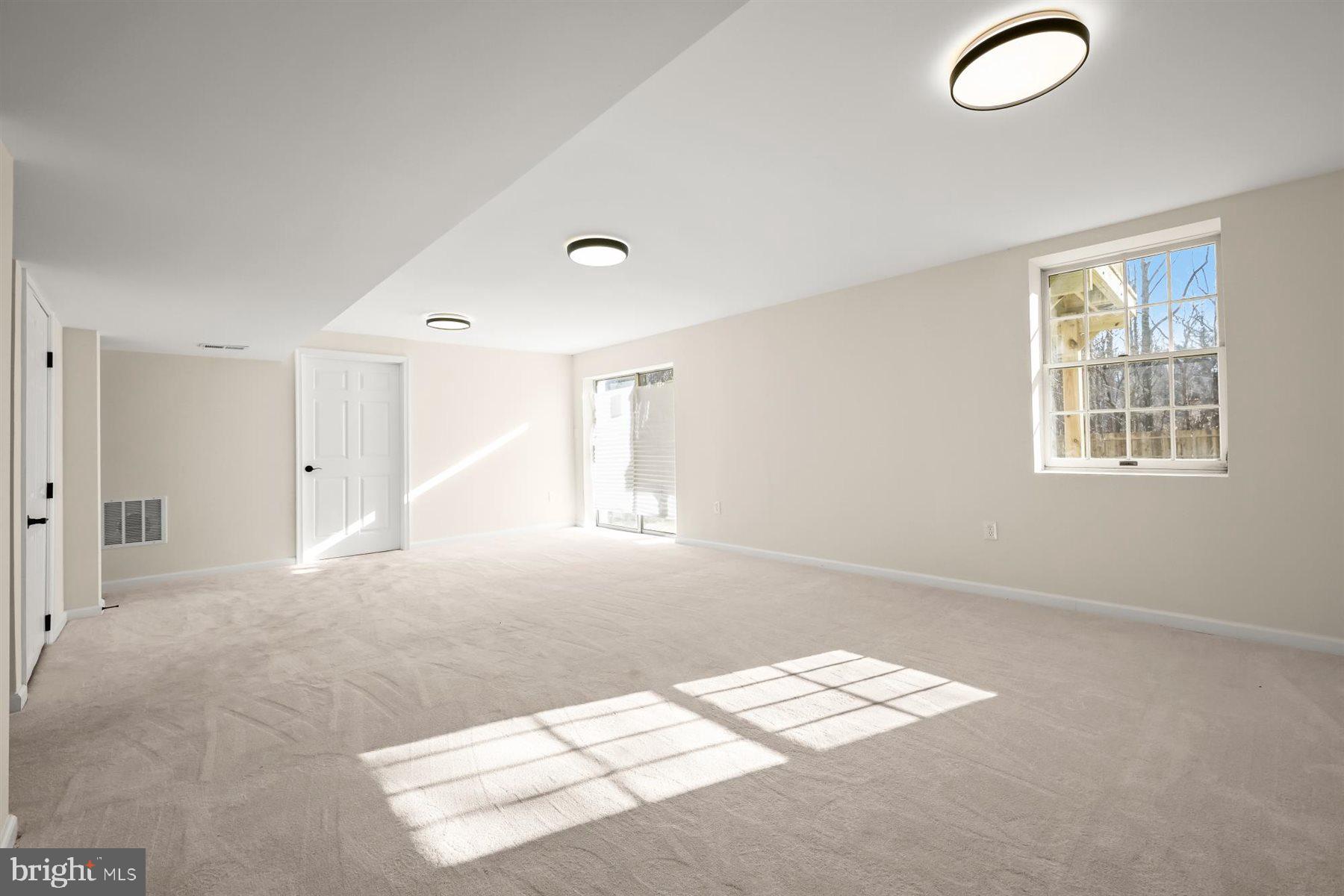 13121 Old Fletchertown Road Bowie, MD 20720 - Photo 61 of 91 a view of wooden floor and windows in a room