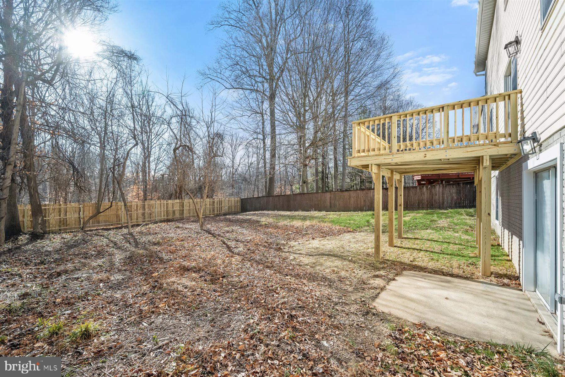13121 Old Fletchertown Road Bowie, MD 20720 - Photo 76 of 91 a backyard of a house with table and chairs