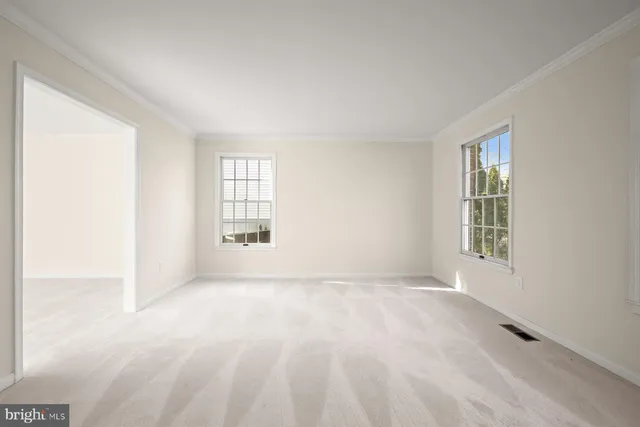 a view of an empty room with stairs
