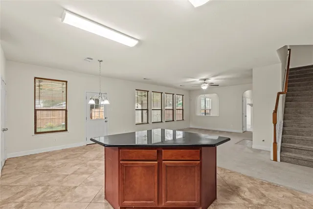 an outdoor view living room with fireplace and windows
