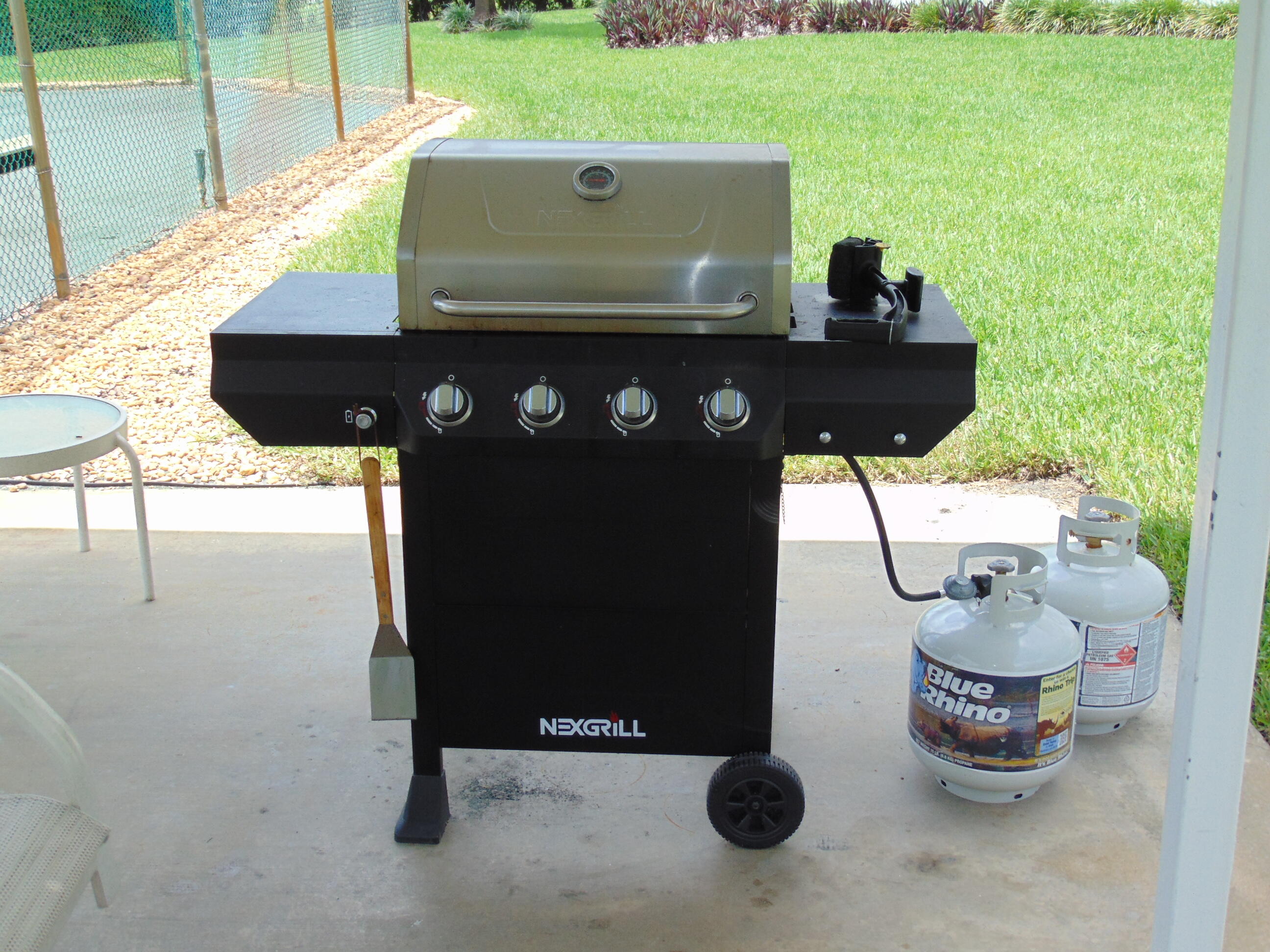 9220 Southwest 14th Street, Unit 3103 Boca Raton, FL 33428 - Photo 48 of 58 a view of barbeque grill and outdoor seating