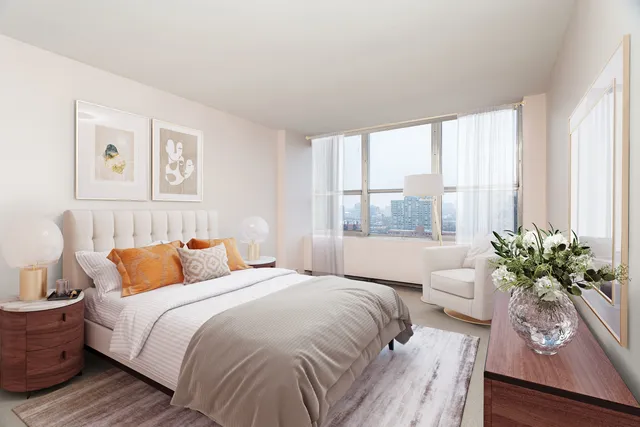 a bedroom with bed and a large window