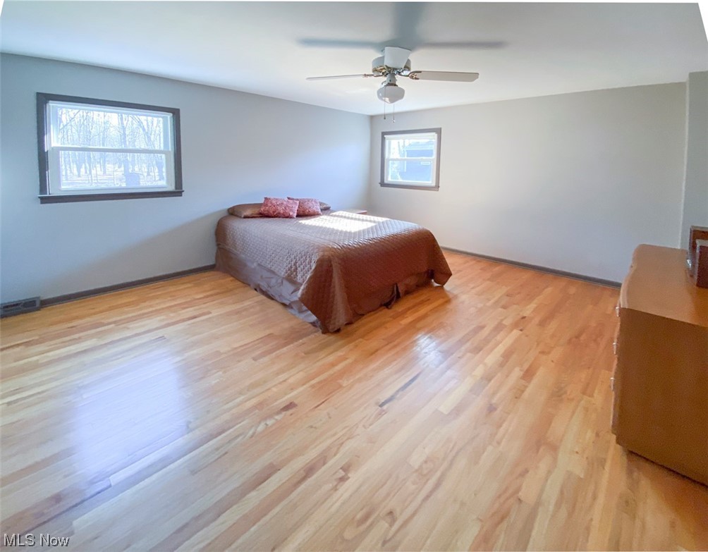 241 Jaycox Road Avon Lake, OH 44012 - Photo 17 of 26 Bedroom featuring ceiling fan and light wood-type flooring