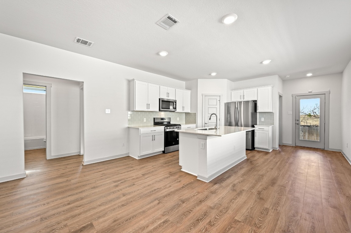 407 Wilshire Road San Marcos, TX 78666 - Photo 11 of 25 a view of kitchen with wooden floor