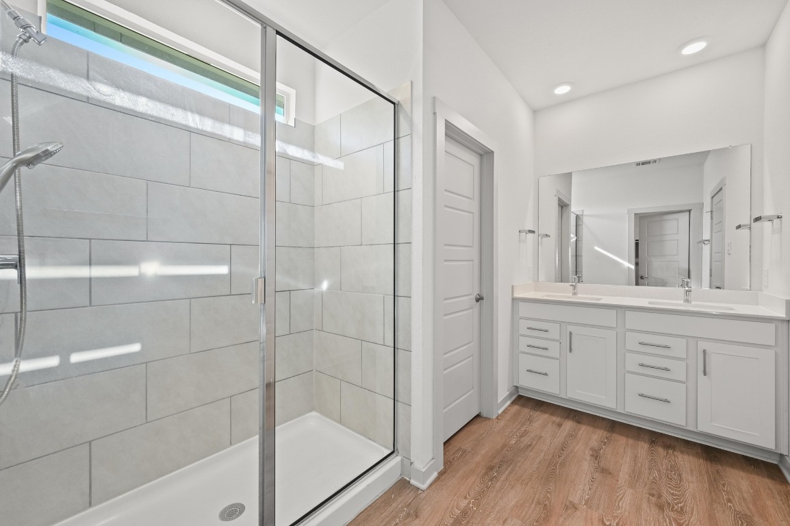 407 Wilshire Road San Marcos, TX 78666 - Photo 17 of 25 a bathroom with a shower and a sink a mirror