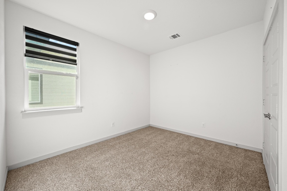 407 Wilshire Road San Marcos, TX 78666 - Photo 18 of 25 an empty room with a window