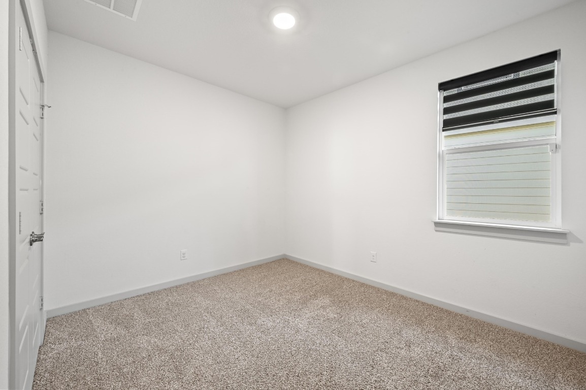 407 Wilshire Road San Marcos, TX 78666 - Photo 19 of 25 an empty room with a window