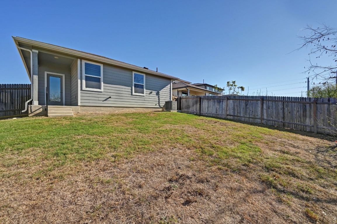 407 Wilshire Road San Marcos, TX 78666 - Photo 23 of 25 a view of a house with a yard