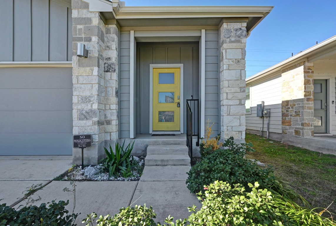 407 Wilshire Road San Marcos, TX 78666 - Photo 4 of 25 a view of a brick house with a yard