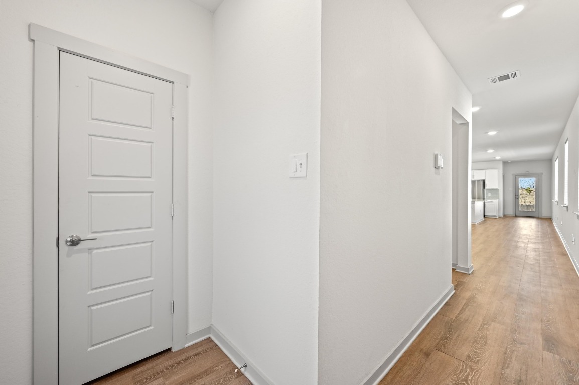 407 Wilshire Road San Marcos, TX 78666 - Photo 5 of 25 a view of a hallway with wooden floor