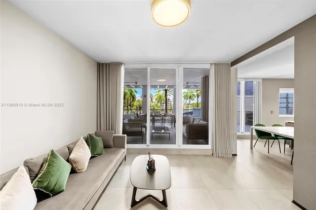 a kitchen with stainless steel appliances kitchen island a sink refrigerator and cabinets