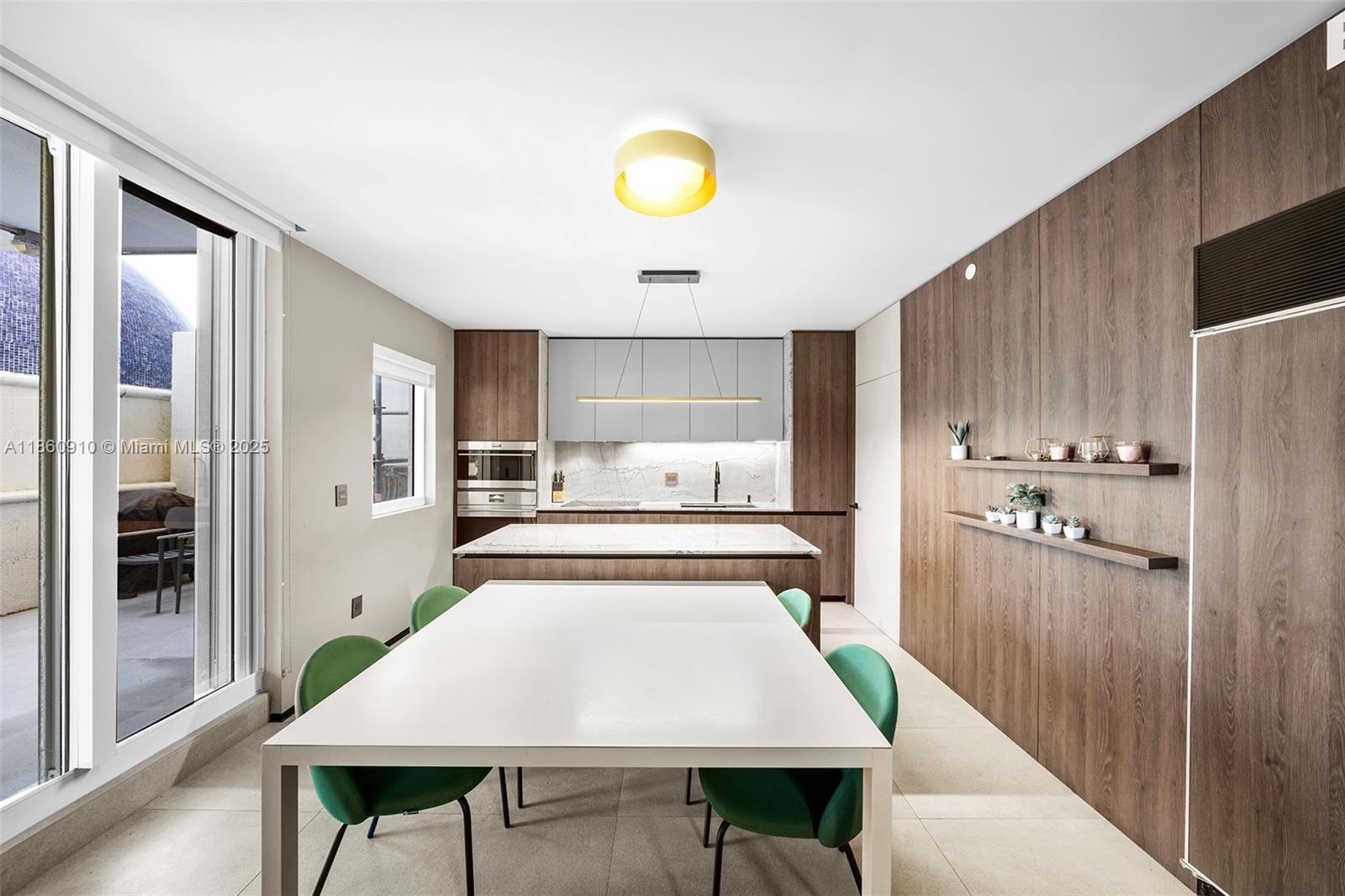 785 Crandon Boulevard, Unit 303 Key Biscayne, FL 33149 - Photo 15 of 57 a kitchen with stainless steel appliances a refrigerator and a stove top oven