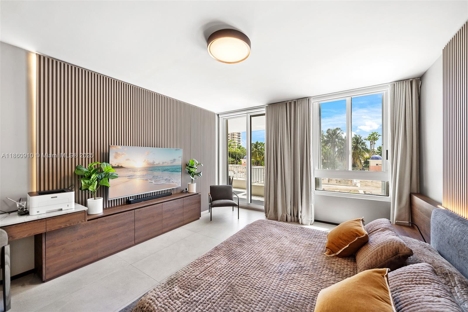 785 Crandon Boulevard, Unit 303 Key Biscayne, FL 33149 - Photo 22 of 57 a living room with furniture and a flat screen tv