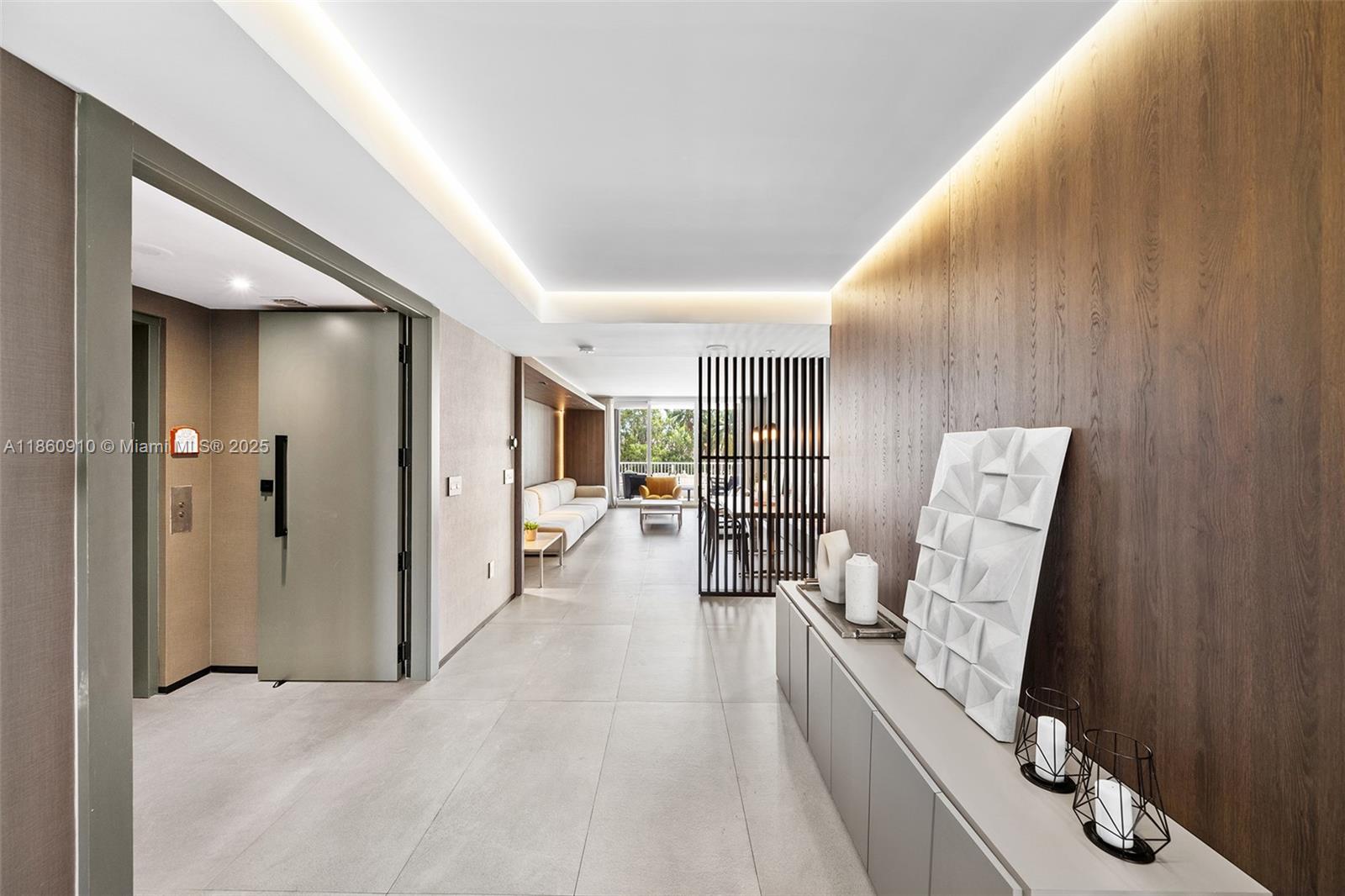 785 Crandon Boulevard, Unit 303 Key Biscayne, FL 33149 - Photo 3 of 57 a view of a hallway with furniture and floor to ceiling window