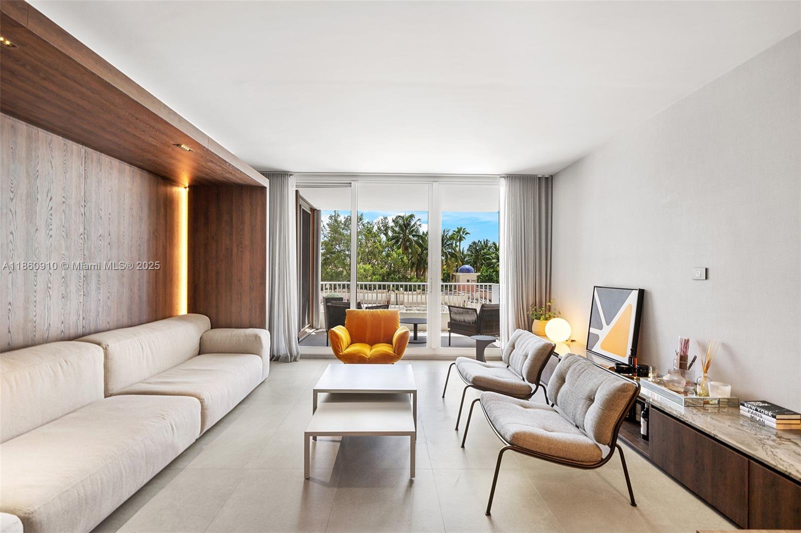 785 Crandon Boulevard, Unit 303 Key Biscayne, FL 33149 - Photo 5 of 57 a living room with furniture and a large window