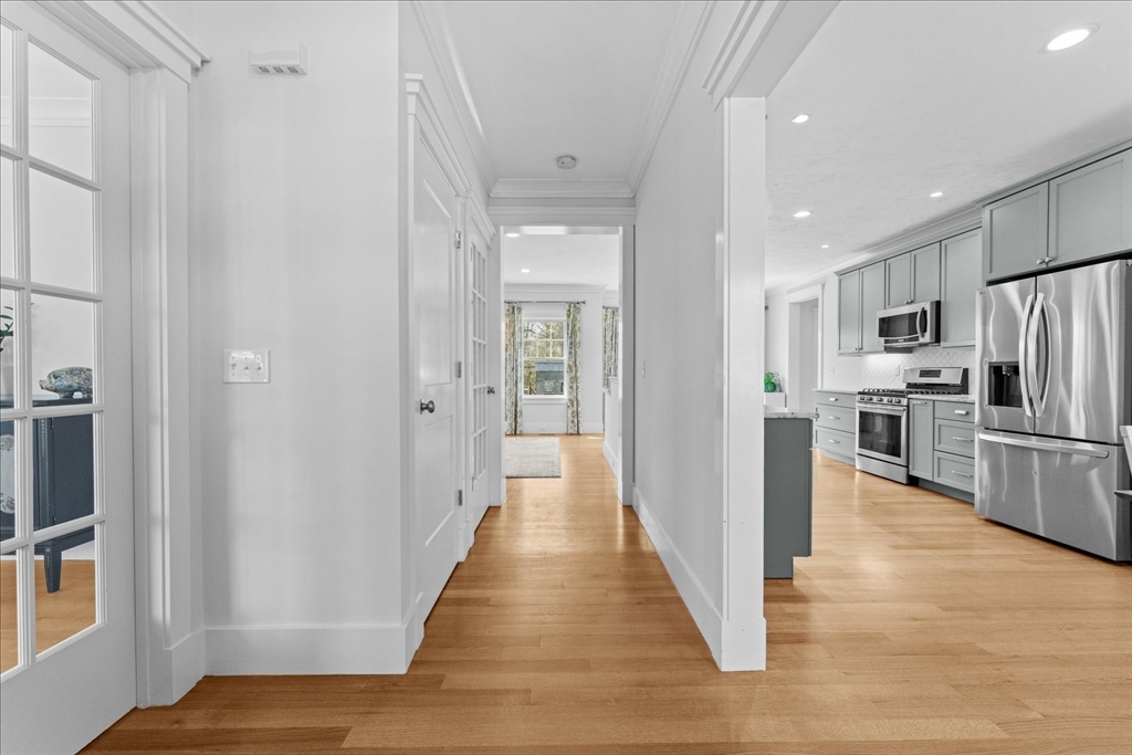 50 Quabbin Path Sutton, MA 01590 - Photo 9 of 42 a view of a kitchen from the hallway