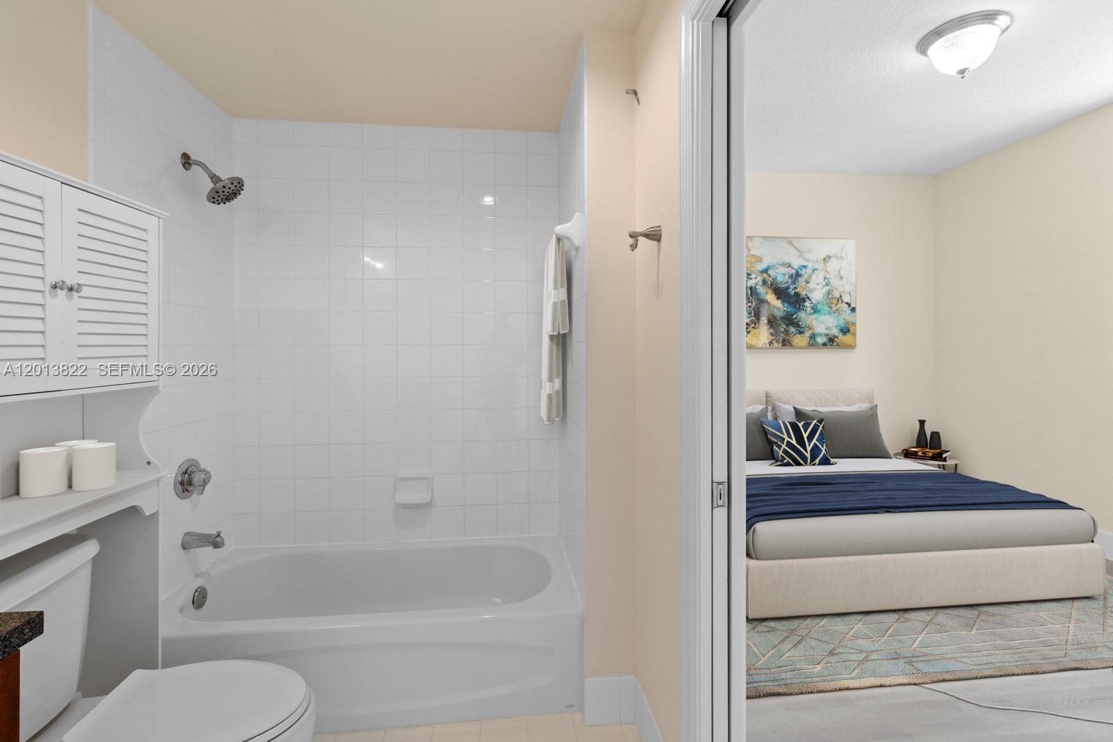 115 Southwest 11th Street, Unit 707 Miami, FL 33130 - Photo 9 of 25 a bathroom with a tub and toilet