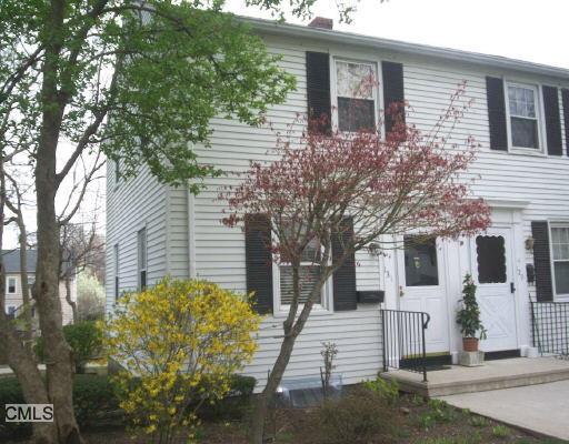 131 Sylvan Knoll Road, Unit 131 Stamford, CT 06902 - Photo 1 of 1 a view of a house with a tree
