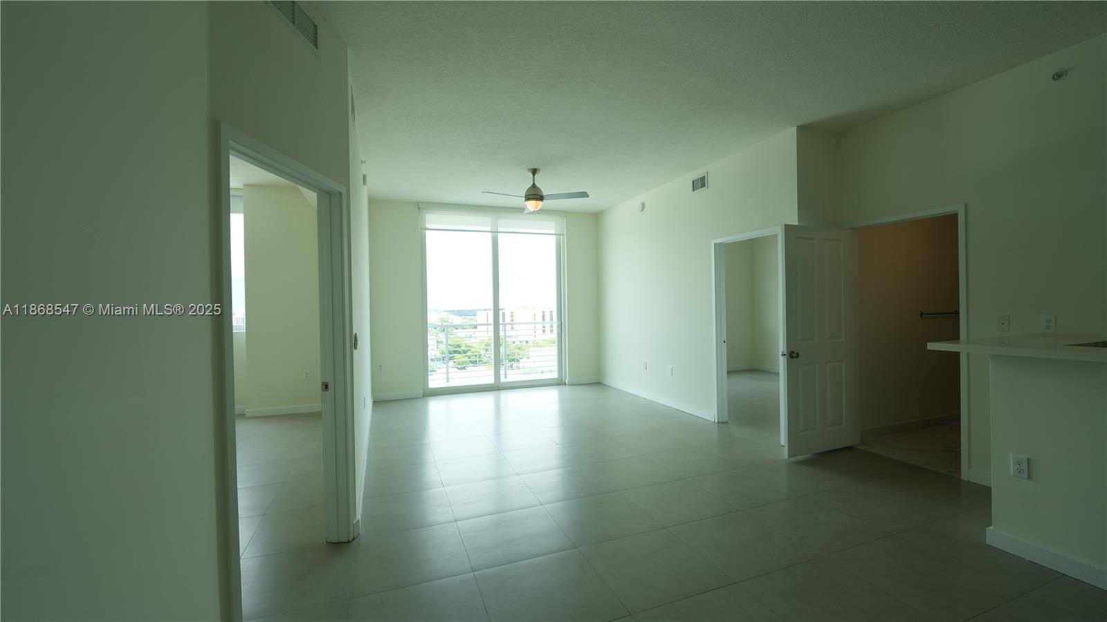 729 Northwest 2nd Street, Unit 717 Miami, FL 33128 - Photo 4 of 25 a view of an empty room and window