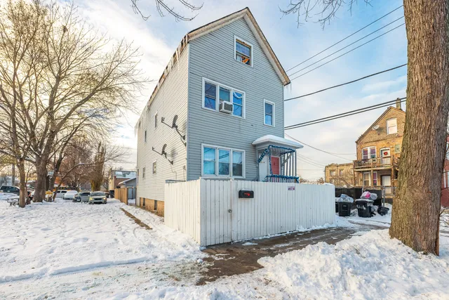a view of a street with a building in the background