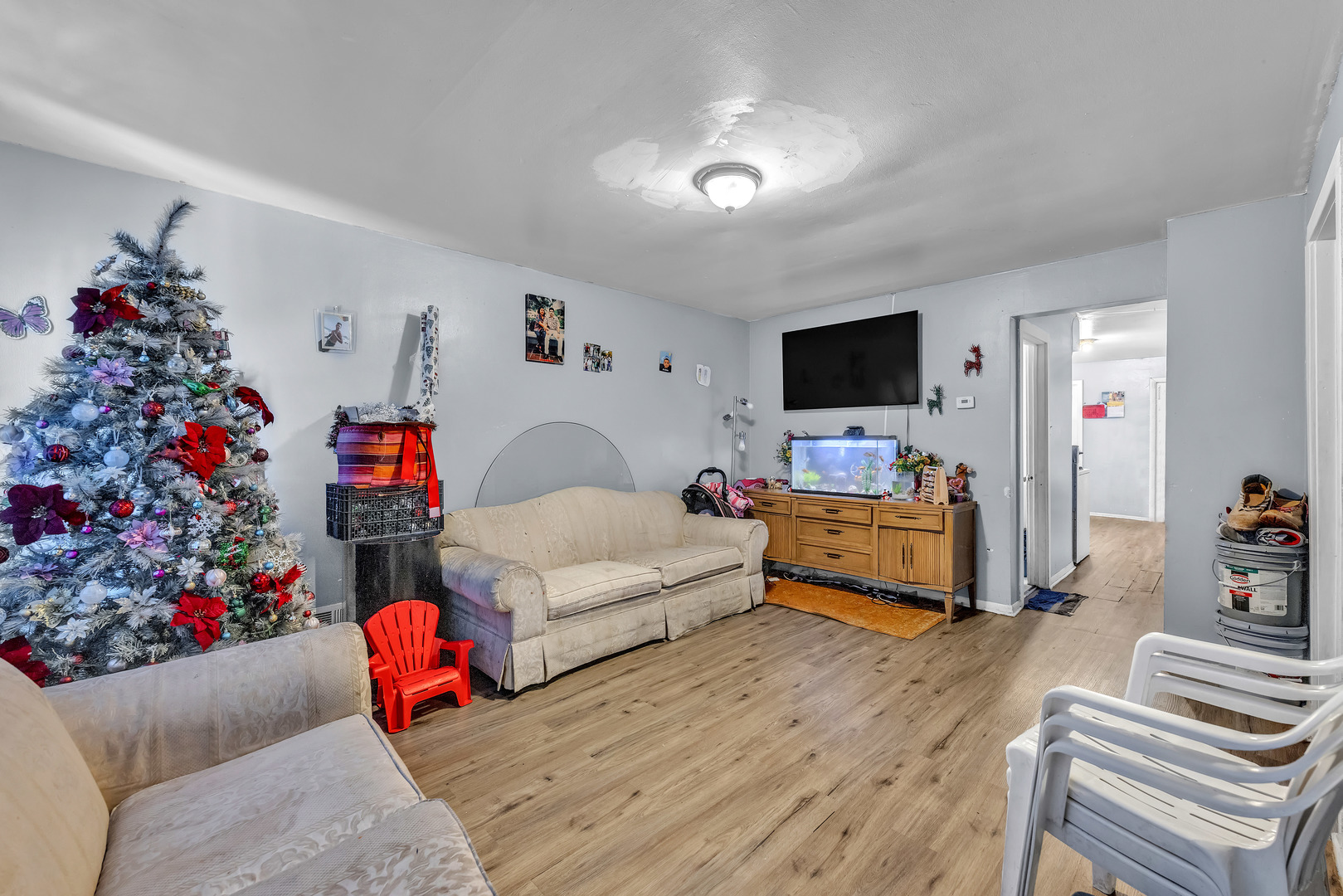 5114 South Justine Street Chicago, IL 60609 - Photo 11 of 37 a living room with furniture and a flat screen tv