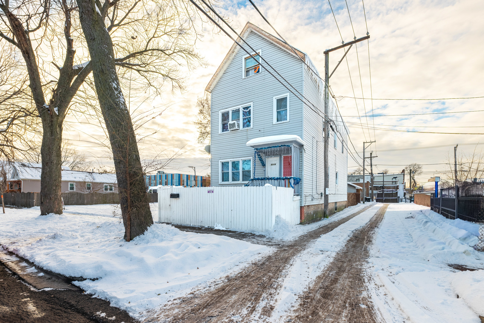 5114 South Justine Street Chicago, IL 60609 - Photo 2 of 37 a view of a house with snow on the road