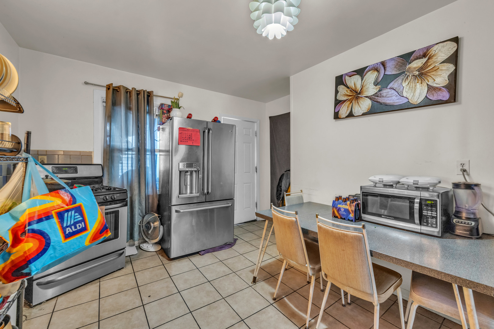 5114 South Justine Street Chicago, IL 60609 - Photo 21 of 37 a kitchen with stainless steel appliances granite countertop a sink and a refrigerator