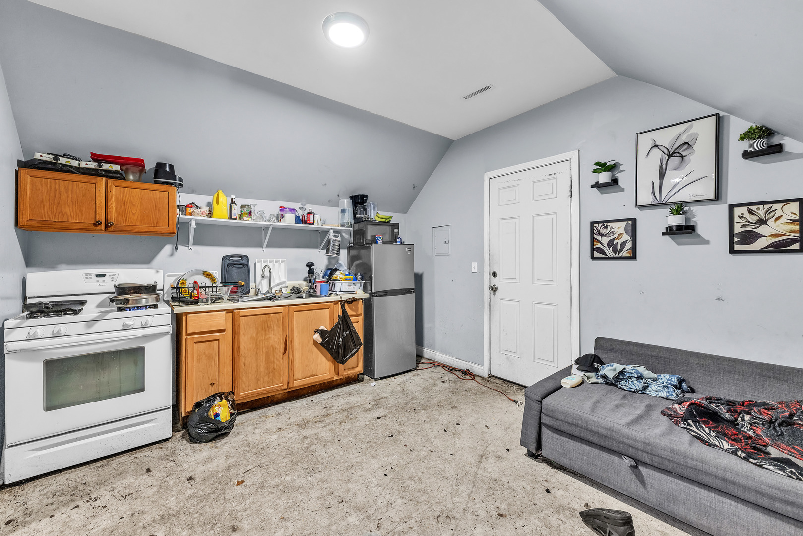 5114 South Justine Street Chicago, IL 60609 - Photo 23 of 37 a kitchen with stainless steel appliances granite countertop a stove and a sink