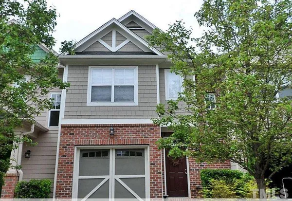 a front view of a house with a garage