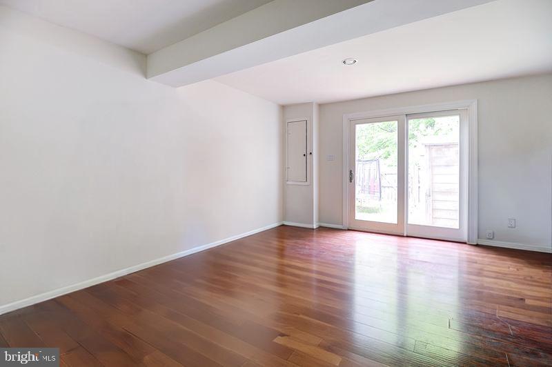 8416 Cedar Falls Court Springfield, VA 22153 - Photo 7 of 9 a view of an empty room with wooden floor and window