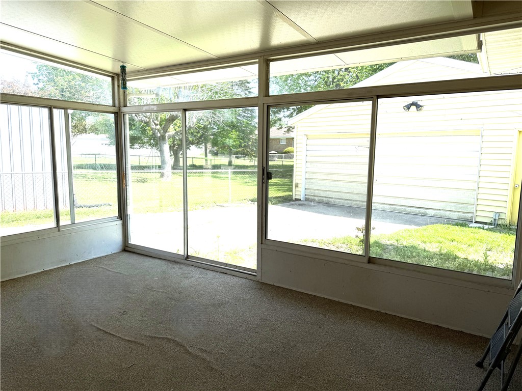 4732 Lehigh Drive Springfield, OH 45503 - Photo 24 of 27 This sunroom offers abundant natural light and seamless access to the outdoor living spaces.