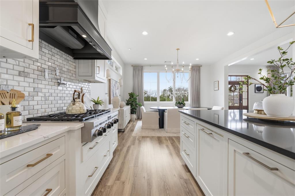 17001 Escondida Court Woodway, TX 76712 - Photo 13 of 40 a large kitchen with stainless steel appliances granite countertop a lot of counter space
