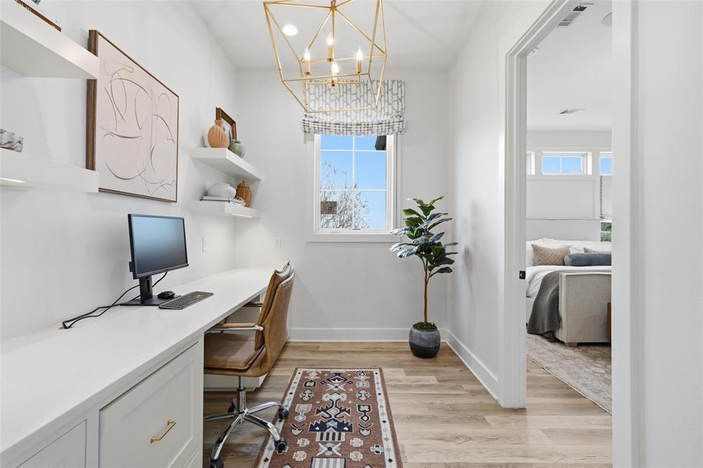 17001 Escondida Court Woodway, TX 76712 - Photo 15 of 40 a view of a workspace with furniture and a chandelier