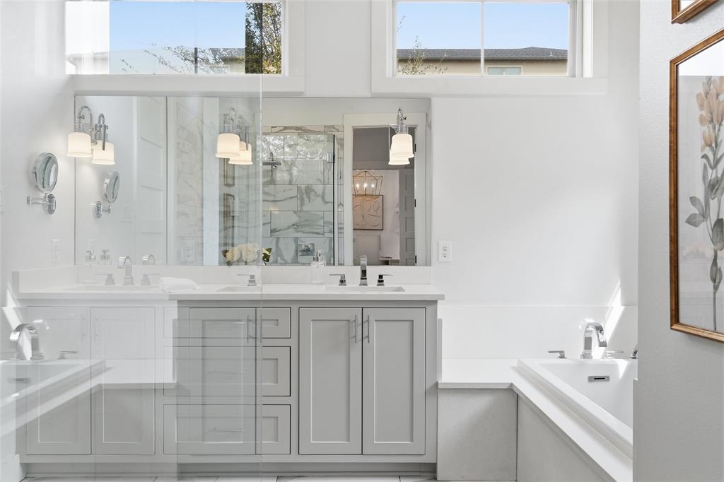 17001 Escondida Court Woodway, TX 76712 - Photo 18 of 40 a bathroom with double sink and a mirror