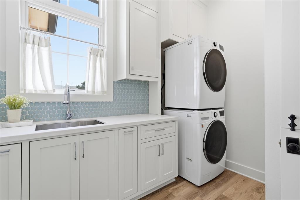 17001 Escondida Court Woodway, TX 76712 - Photo 22 of 40 a utility room with sink dryer and washer