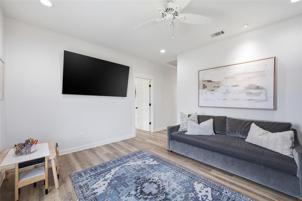 17001 Escondida Court Woodway, TX 76712 - Photo 25 of 40 a living room with furniture and a flat screen tv