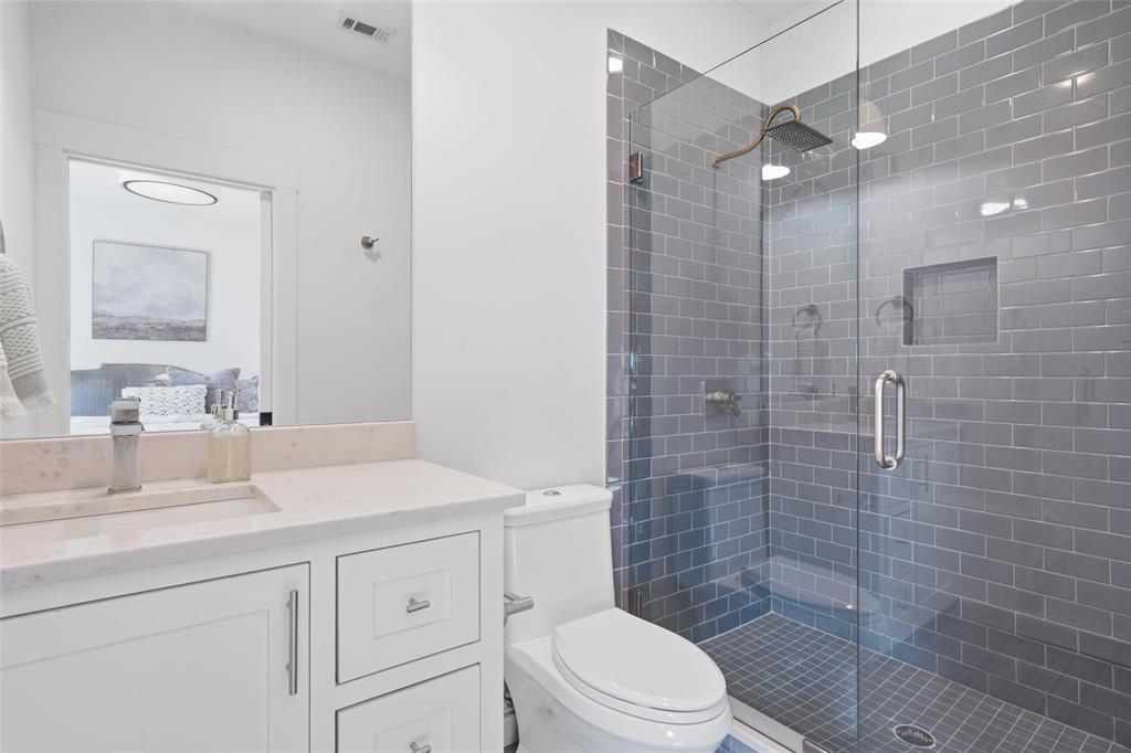 17001 Escondida Court Woodway, TX 76712 - Photo 27 of 40 a bathroom with a sink a toilet and shower