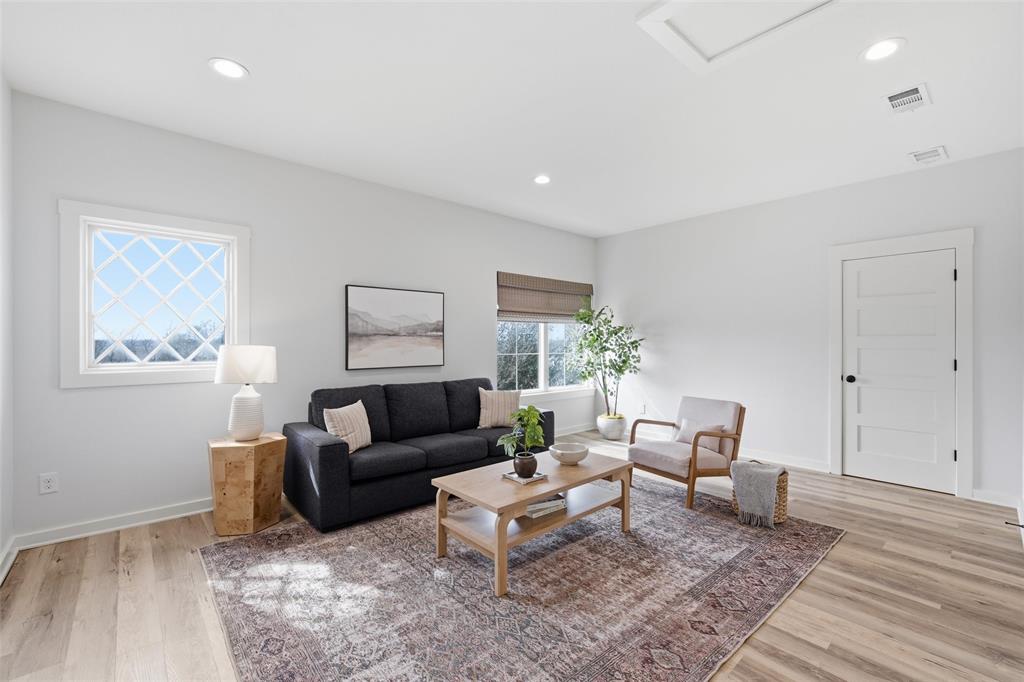 17001 Escondida Court Woodway, TX 76712 - Photo 30 of 40 a living room with furniture and wooden floor