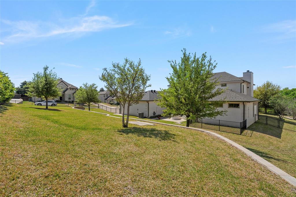 17001 Escondida Court Woodway, TX 76712 - Photo 33 of 40 a house with swimming pool in front of it