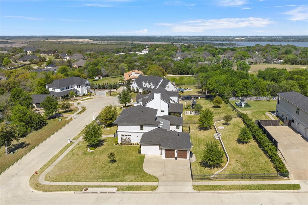 17001 Escondida Court Woodway, TX 76712 - Photo 35 of 40 an aerial view of residential houses with outdoor space and ocean view